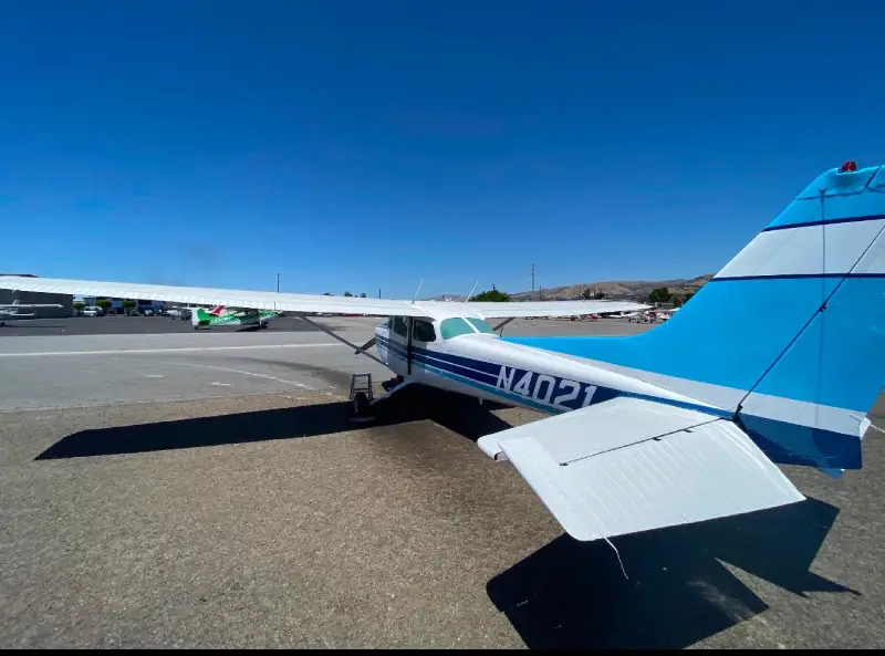 Rear three-quarter view of a single-engine airplane