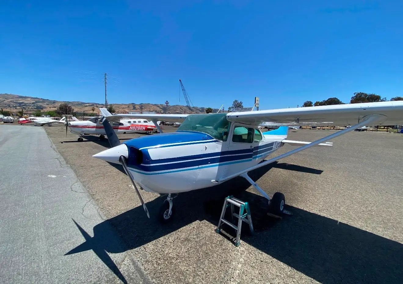 Airplane parked on the tarmac with a step ladder
